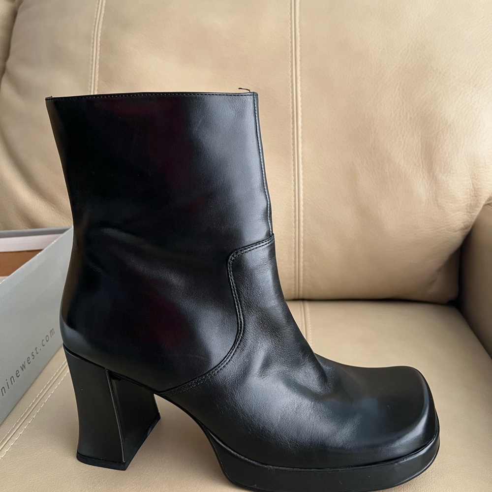 Brand new black leather boot.